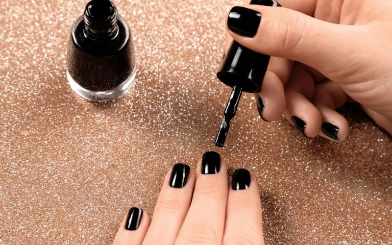 Apply Black Nail Polish